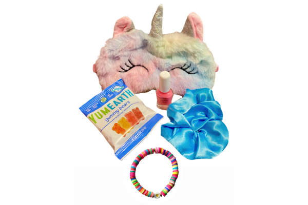 A unicorn mask, bracelet and candy are all in this picture.