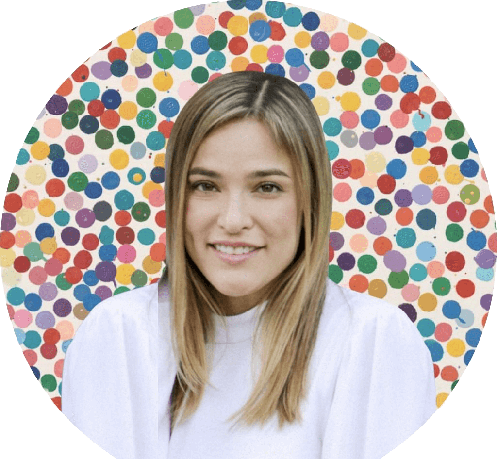 A woman in front of a colorful background.